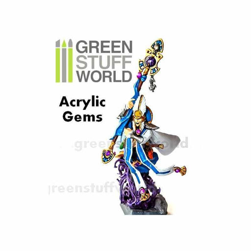 A figurine holding a great staff adorned with acrylic gems